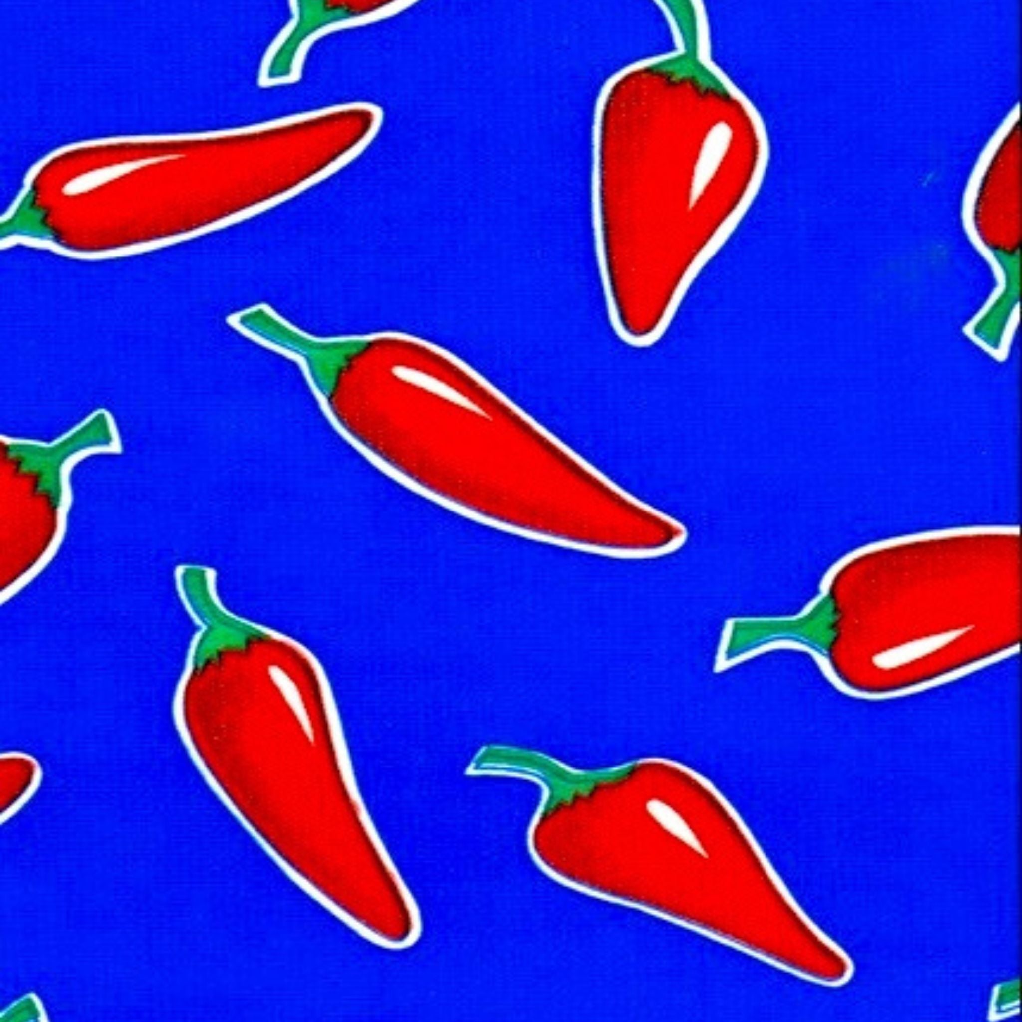 chili peppers on blue oilcloth swatch