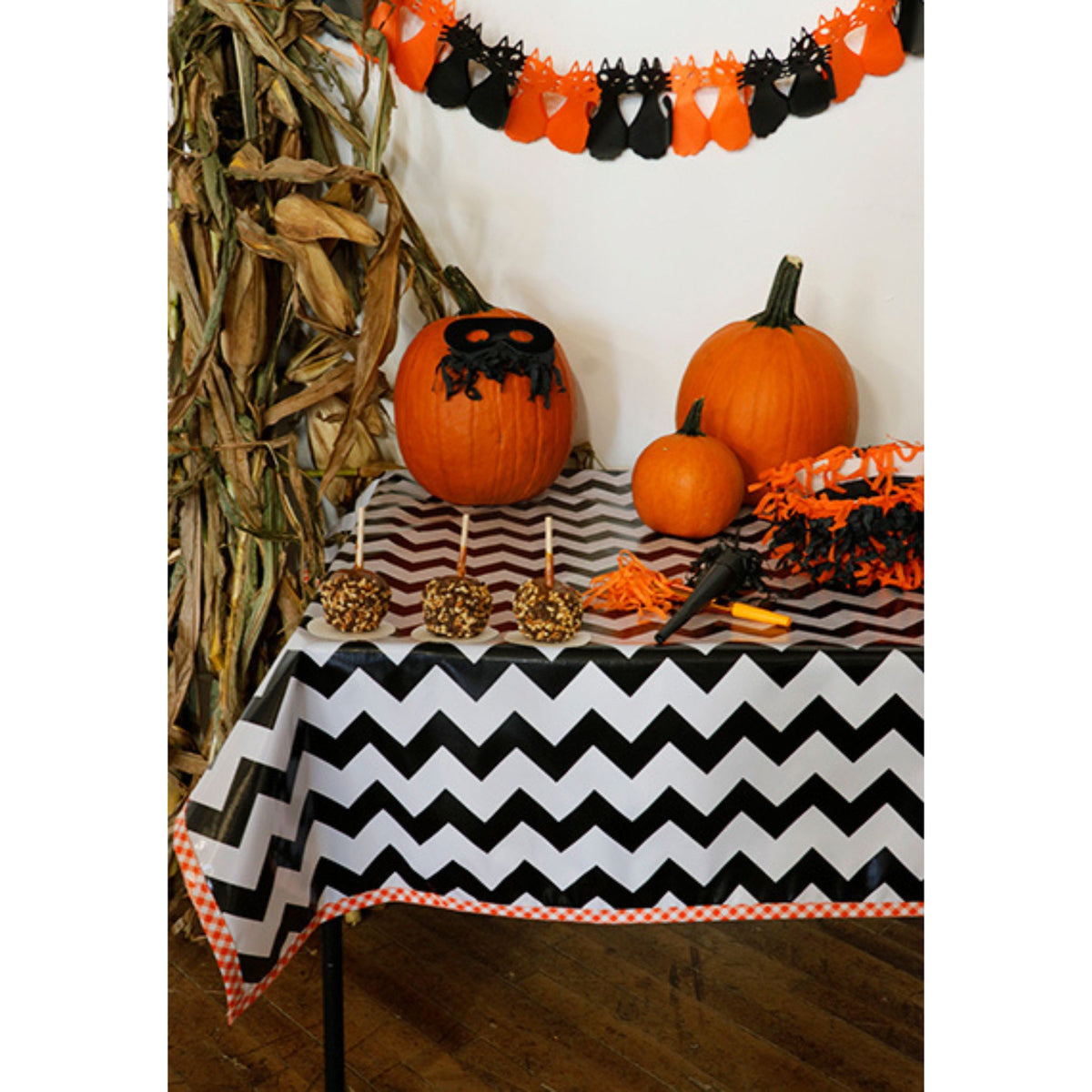 freckled sage chevron black oilcloth tablecloth with orange gingham trim decorated for halloween