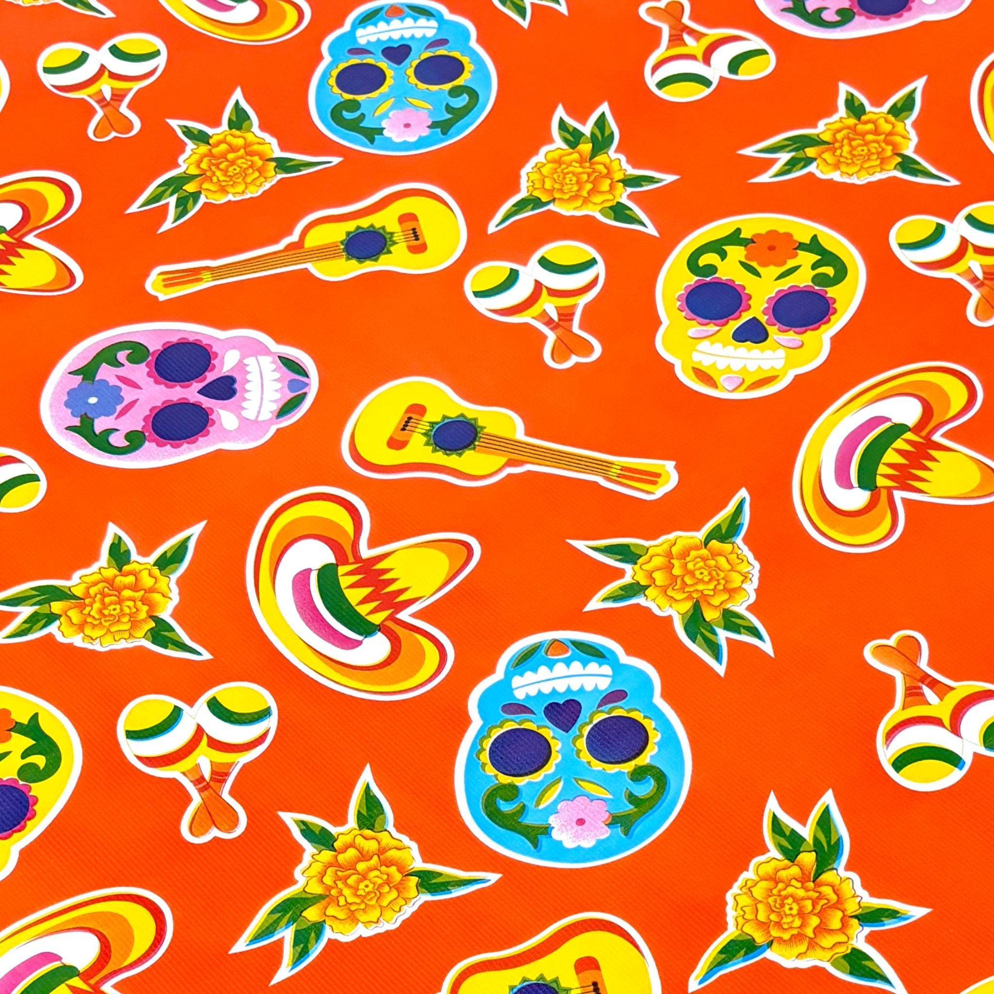 skulls on orange oilcloth swatch