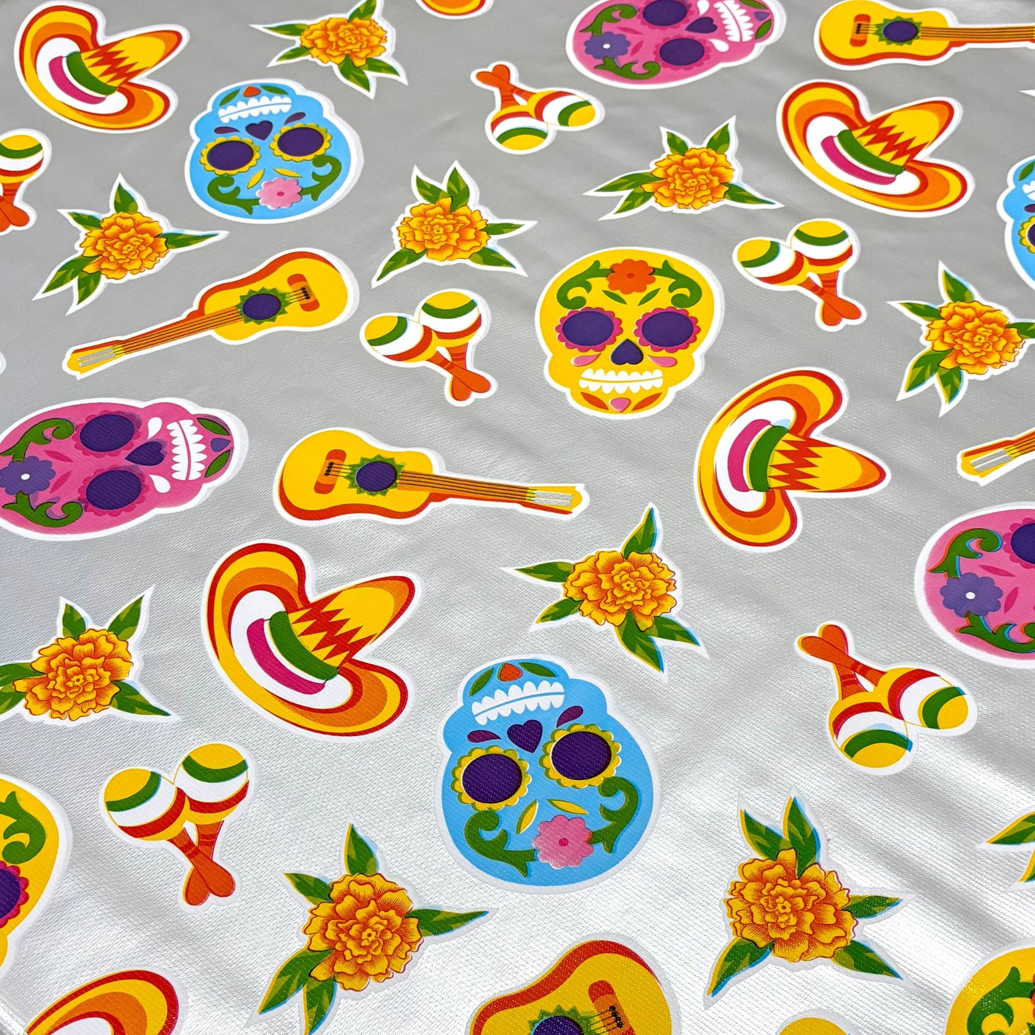 skulls on silver oilcloth fabric