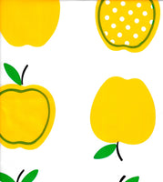 Oilcloth fabric swatch yellow apples with polka dots on solid white background