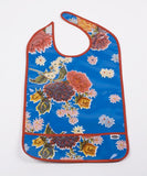 Adult Oilcloth Bib mums on blue background with solid red trim and crumb catcher pocket