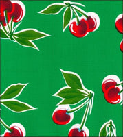 Cherries on Green oilcloth fabric swatch