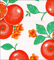Oranges on white oilcloth fabric
