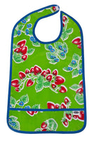 Oilcloth Adult Bib strawberries on solid green background with crumb catching pocket