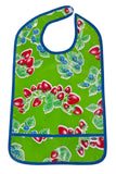 Oilcloth Adult Bib strawberries on solid green background with crumb catching pocket