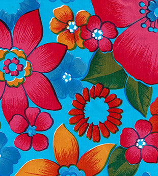 Oilcloth fabric swatch yellow red pink orange blue flowers on light blue background