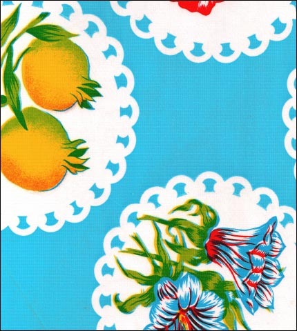 Doily 2 on Light Blue oilcloth with fruit and flowers on large doilies