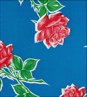 Oilcloth fabric swatch long stemmed red roses on solid blue background