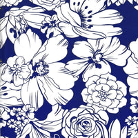 Oilcloth fabric swatch: wild white flowers on solid blue background