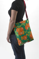 Freckled Sage Oilcloth Crossover Bag in Oranges on Green