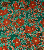 Christmas Ribbons & Holly on Green oilcloth swatch